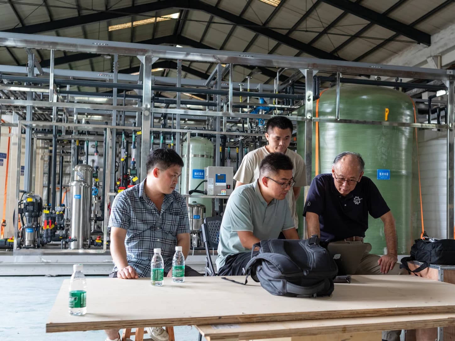 Engineering team reviewing a custom industrial water treatment project