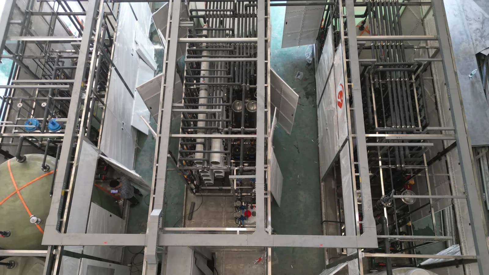 Industrial water treatment equipment and process piping for continuous high-purity water polishing