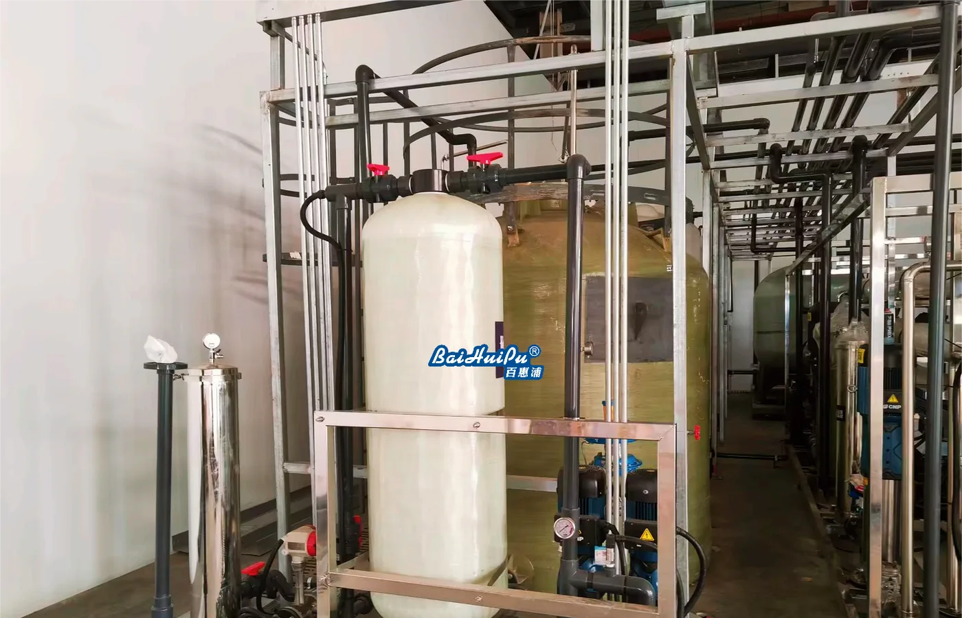 Industrial pure-water treatment equipment with vessels, piping and storage tanks