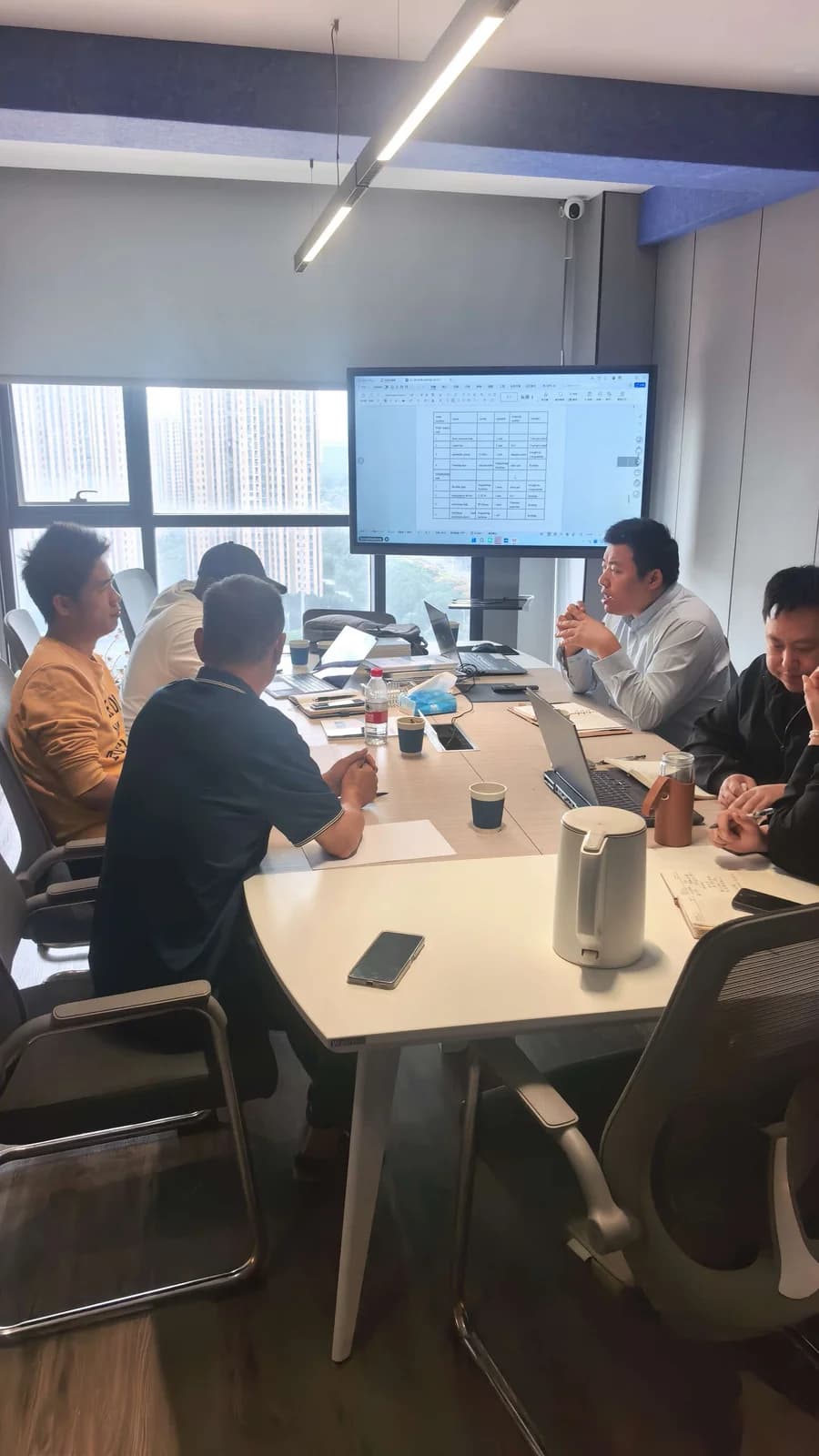 Kenyan customer and BHP engineering team reviewing project documentation during the MVR evaporator technical session