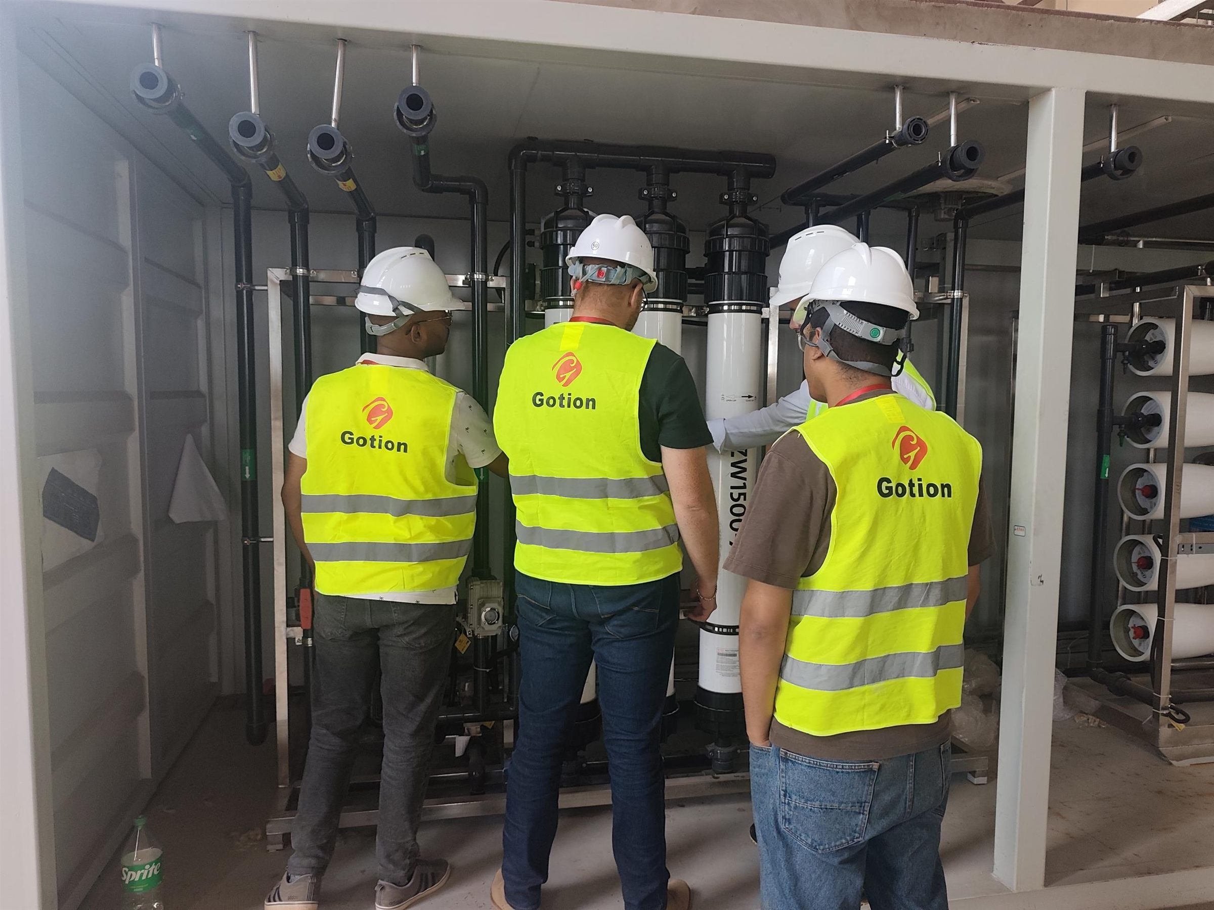 Baihuipu engineers reviewing an industrial pure water system